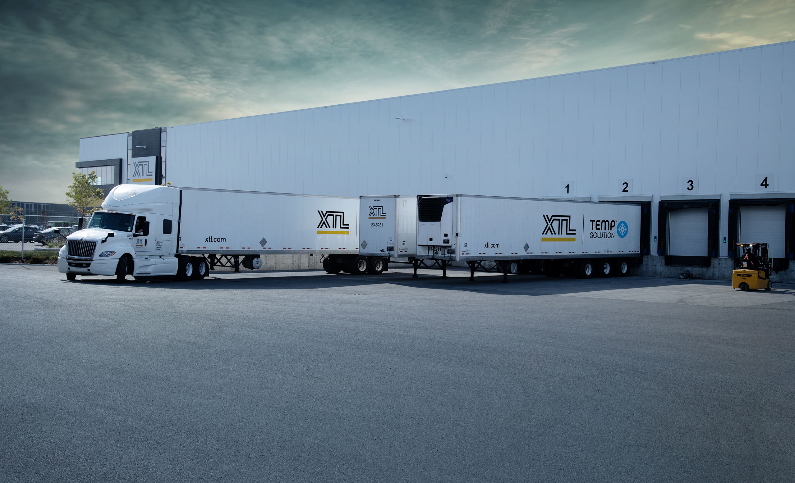 XTL warehousing and crossdock terminal with a truck and multiple trailers