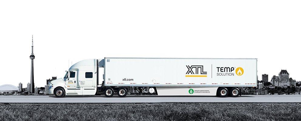 XTL transport truck and trailer driving on road with the city of Toronto in the background an example of trucking jobs available